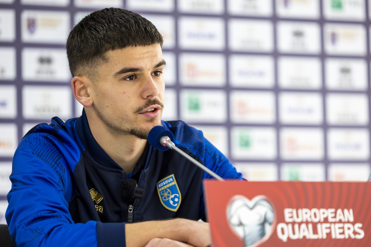 Kosovo's defender Albian Hajdari speaks to the media during a press conference of Kosovo team, one day before the FIFA 2026 World Cup Group B qualifying soccer match against Switzerland, at the s ...
