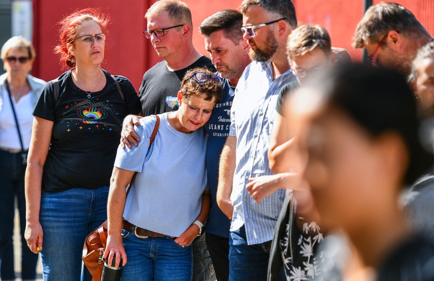epa11562478 Participants of a CSD event mourn in the city center near the crime scene after a knife attack last night during the city festival in Solingen, Germany, 24 August 2024. A man stabbed passe ...