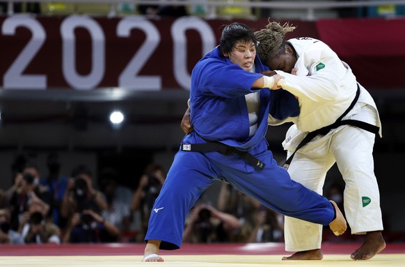 epa09379657 Gold medal winner Akira Sone of Japan (blue) in action against silver medal winner Idalys Ortiz of Cuba (white) during the Women +78 kg Final contest at the Judo events of the Tokyo 2020 O ...