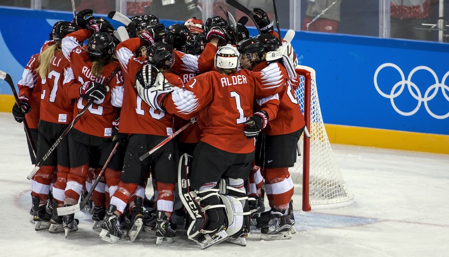 Team of Switzerland celebrate during the women ice hockey preliminary round match between Switzerland and unified Korean team in the Kwandong Hockey Center in Gangneung during the XXIII Winter Olympic ...