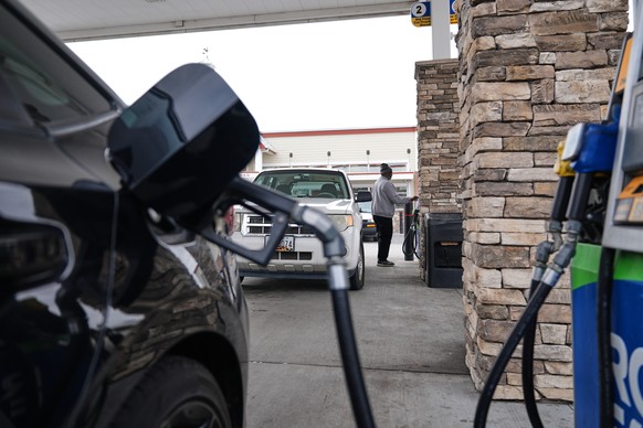 A person fuels their vehicle at a gas station Thursday, March 19, 2026, in Baltimore. (AP Photo/Stephanie Scarbrough)
US Iran Oil