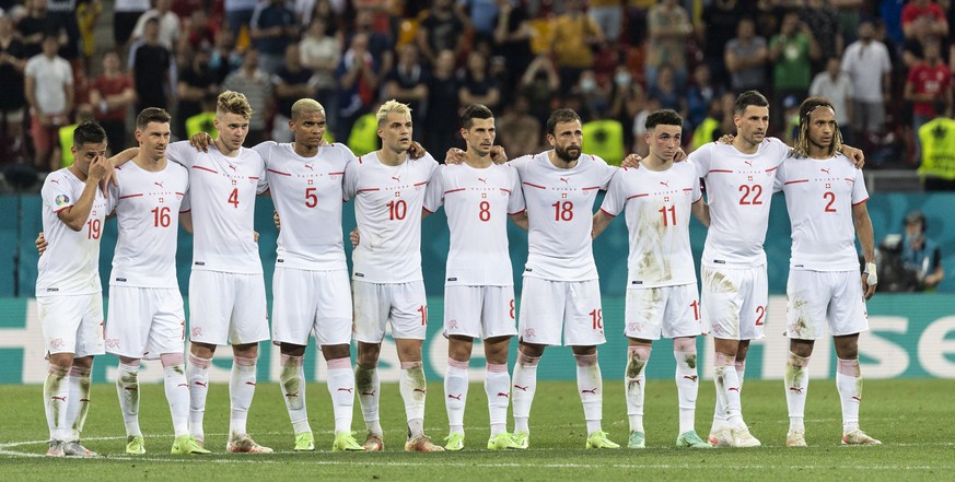 The Swiss players watch the shootout during the Euro 2020 soccer tournament round of 16 match between France and Switzerland at the National Arena stadium, in Bucharest, Romania, Monday, June 28, 2021 ...