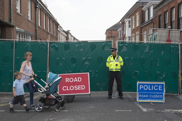 epa06866410 A police officer stands outside the cordon as tents are erected in front of John Baker House, a supported housing scheme for the homeless in Salisbury, Britain, 05 July 2018. Police are in ...