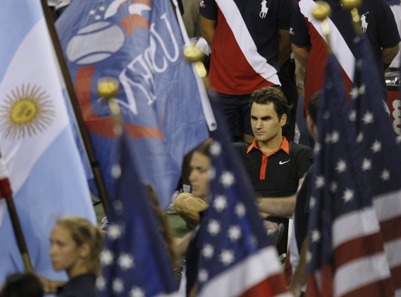 Roger Federer, of Switzerland, sits in his court side chair while waiting for trophy presentations after his defeat by Juan Martin del Potro, of Argentina, in the men&#039;s finals championship at the ...
