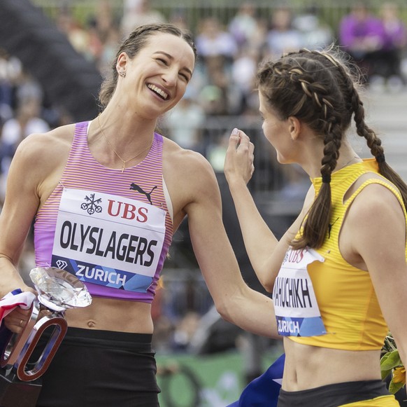 Winner Nicola Olyslagers of Australia, left, and second placed Yaroslava Mahuchikh of Ukraine celebrate after the high jump women competition at the Wanda Diamond League Final 2025 athletics meeting i ...