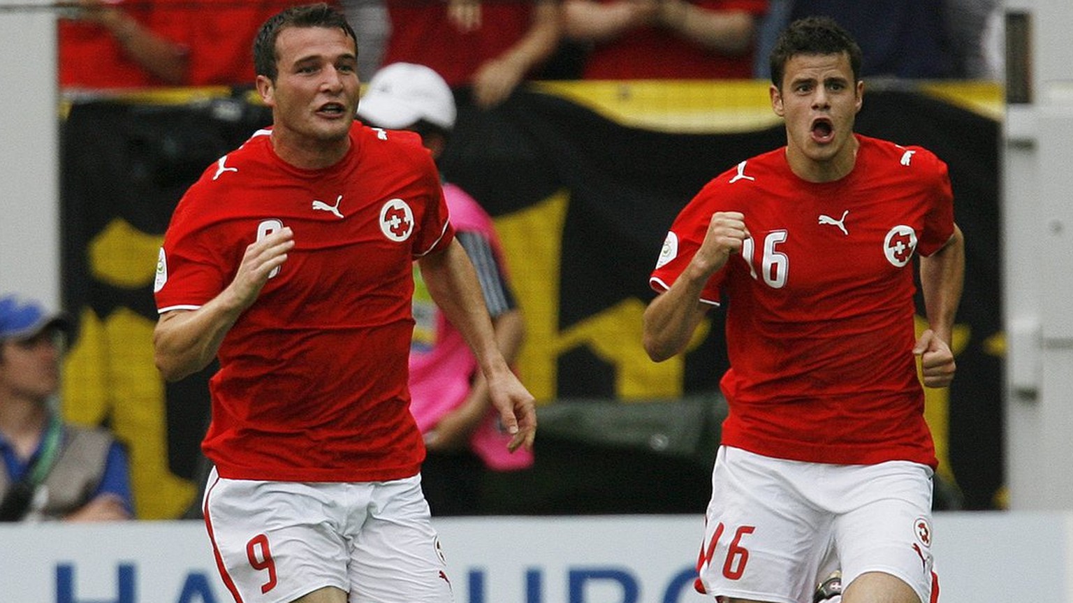 Alexander Frei, left, and Tranquillo Barnetta, right, who scored the 2nd goal for his team, celebrate after Frei scored the 1:0 during the Group G match between Switzerland and Togo in Dortmund&#039;s ...