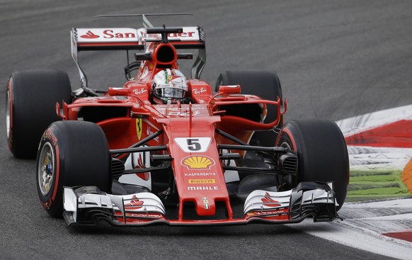 Ferrari driver Sebastian Vettel of Germany takes a curve during the first free practice for Sunday&#039;s Italian Formula One Grand Prix, at the Monza racetrack, Italy, Friday, Sept.1, 2017. (AP Photo ...