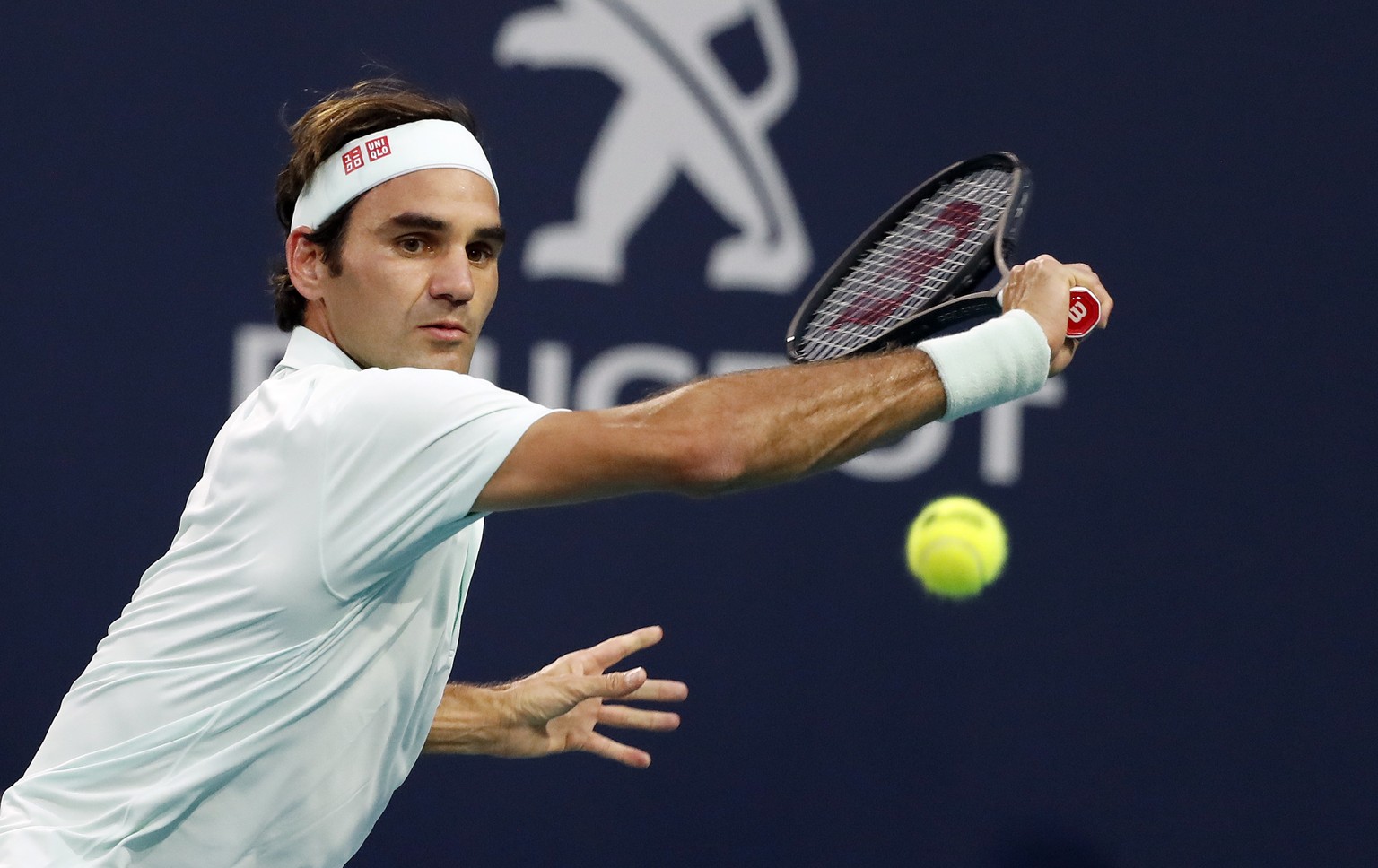 epa07472381 Roger Federer of Switzerland in action against Denis Shapovalov of Canada during their semifinal match at the Miami Open tennis tournament in Miami, Florida, USA, 29 March 2019. EPA/RHONA  ...