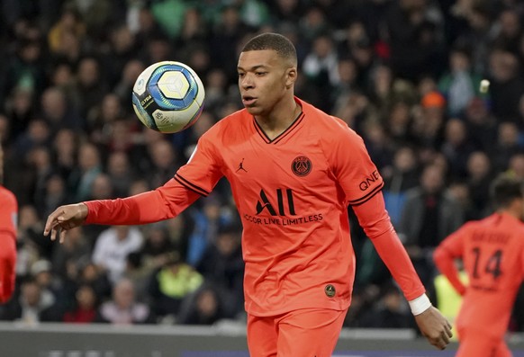 PSG's Kylian Mbappe controls the ball during the French League One soccer match between Saint-Etienne and Paris Saint-Germain, at the Geoffroy Guichard stadium, in Saint-Etienne, central France, ...