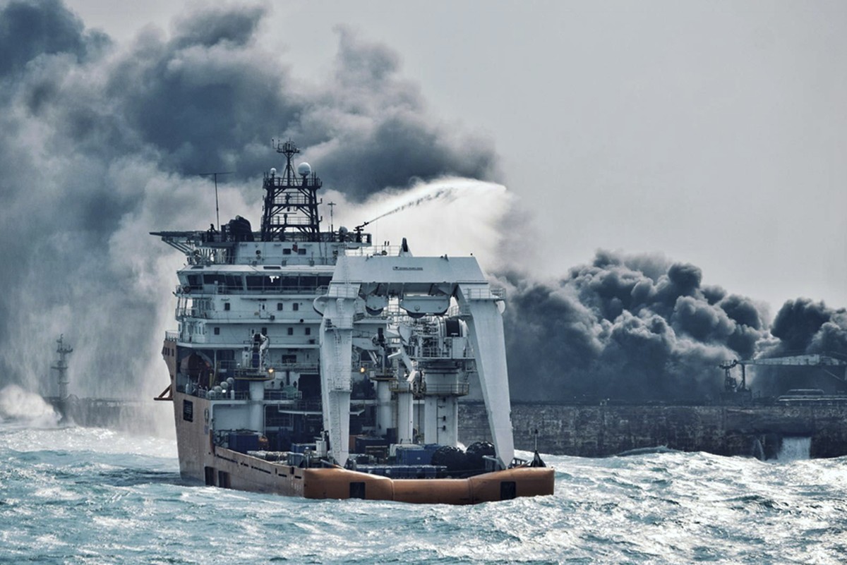 In this Jan. 10, 2018 photo provided by China's Ministry of Transport, a firefighting boat works to put on a blaze on the oil tanker Sanchi in the East China Sea off the eastern coast of China. R ...