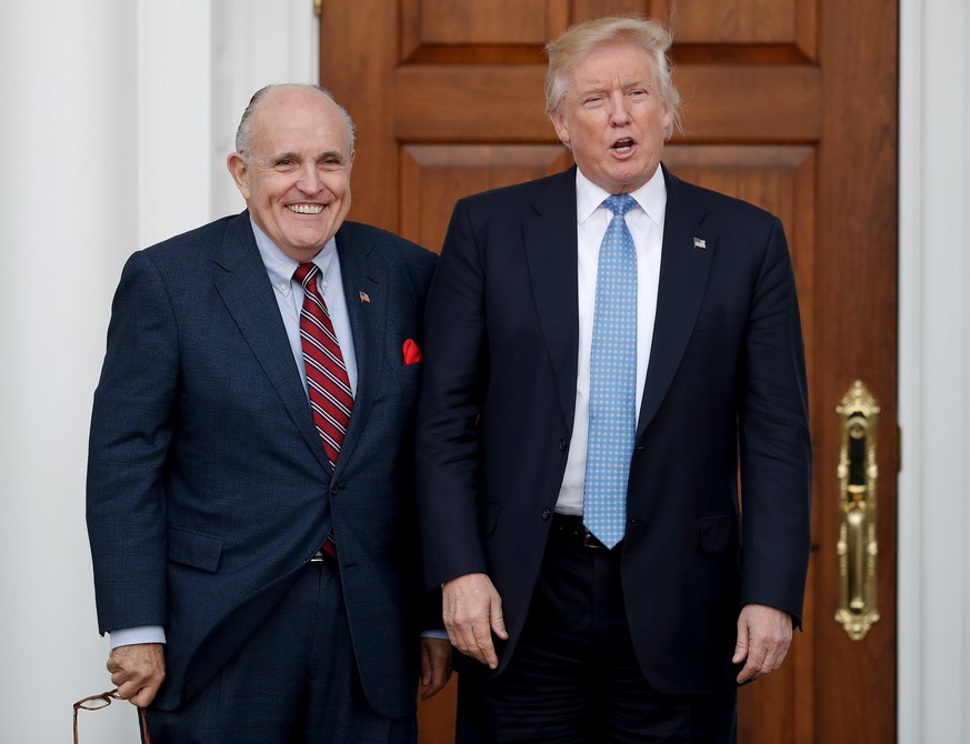 FILE - In this Nov. 20, 2016, file photo, then-President-elect Donald Trump, right, and former New York Mayor Rudy Giuliani pose for photographs as Giuliani arrives at the Trump National Golf Club Bed ...