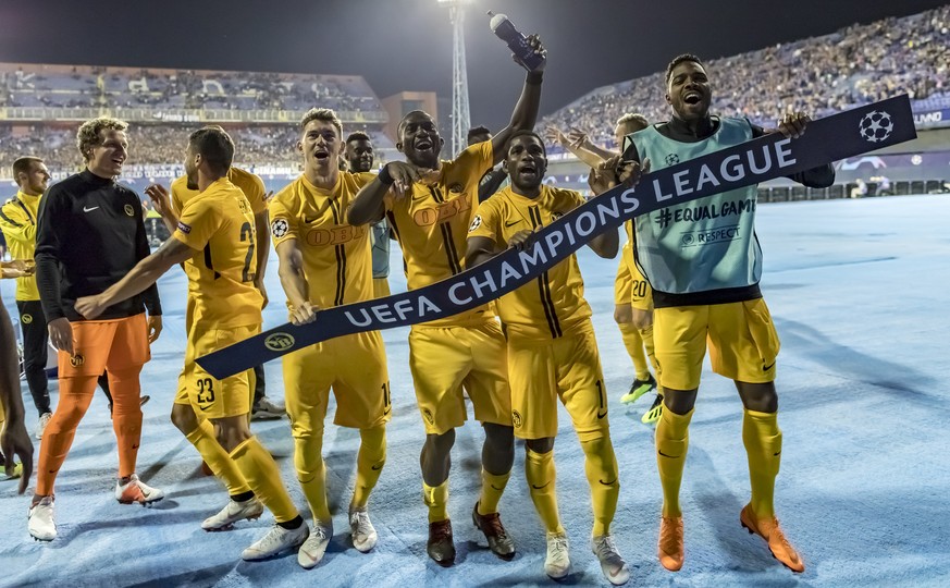 YBs Marco Woelfli, Loris Benito, Christian Fassnacht, Sekou Sanogo, Roger Assale and Ulisses Garcia, from left, celebrate after the UEFA Champions League football 2nd leg playoff match between GNK Din ...