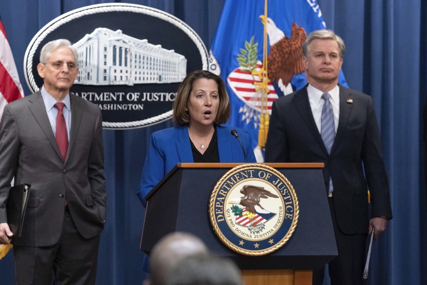 Deputy Attorney General Lisa Monaco flanked by Attorney General Merrick Garland, left, and Federal Bureau of Investigation (FBI) Director Christopher Wray speaks during a news conference to announce a ...