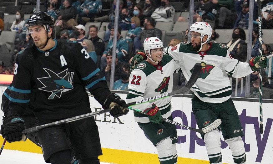 Minnesota Wild left wing Jordan Greenway, right, is congratulated by Kevin Fiala (22) after scoring a goal against the San Jose Sharks during the second period of an NHL hockey game Thursday, Dec. 9,  ...