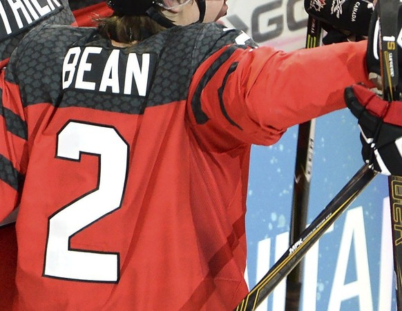 Canada forward Nicolas Roy (25) celebrates his goal against the United States with teammates Julien Gauthier (12) and Jake Bean (2) during the third period of the gold medal hockey game at the World J ...