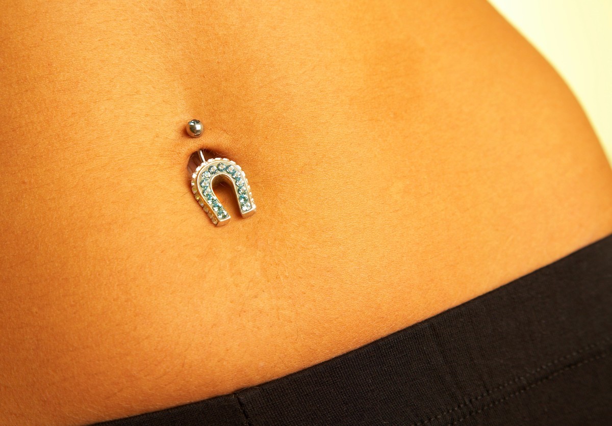 RECORD DATE NOT STATED female navel with piercing...