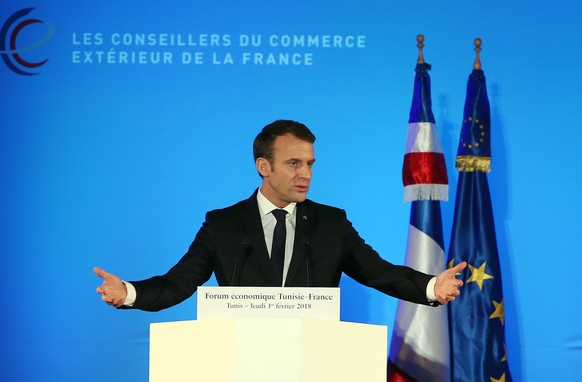 epa06489919 French President Emmanuel Macron (L) speaks during the first Tunisian-French Economic Forum in Tunis, Tunisia, 01 February 2018. Macron is on a two-day first state visit to Tunisia. EPA/MO ...