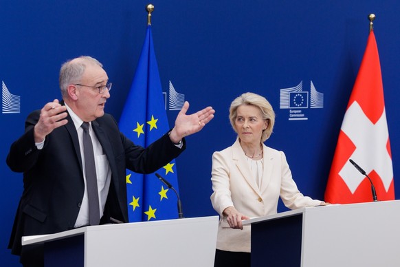 epa12789280 European Commission President Ursula von der Leyen (R) and Swiss President Guy Parmelin announce the signature of a broad package of EU-Switzerland agreements in the European Commission in ...