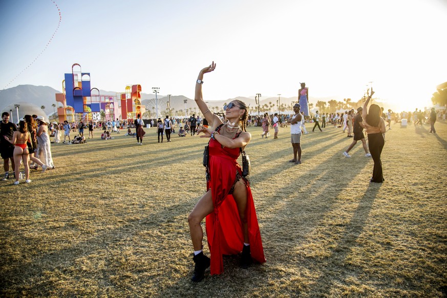 Festivalgoers attend the Coachella Music &amp; Arts Festival at the Empire Polo Club on Sunday, April 17, 2022, in Indio, Calif. (Photo by Amy Harris/Invision/AP)