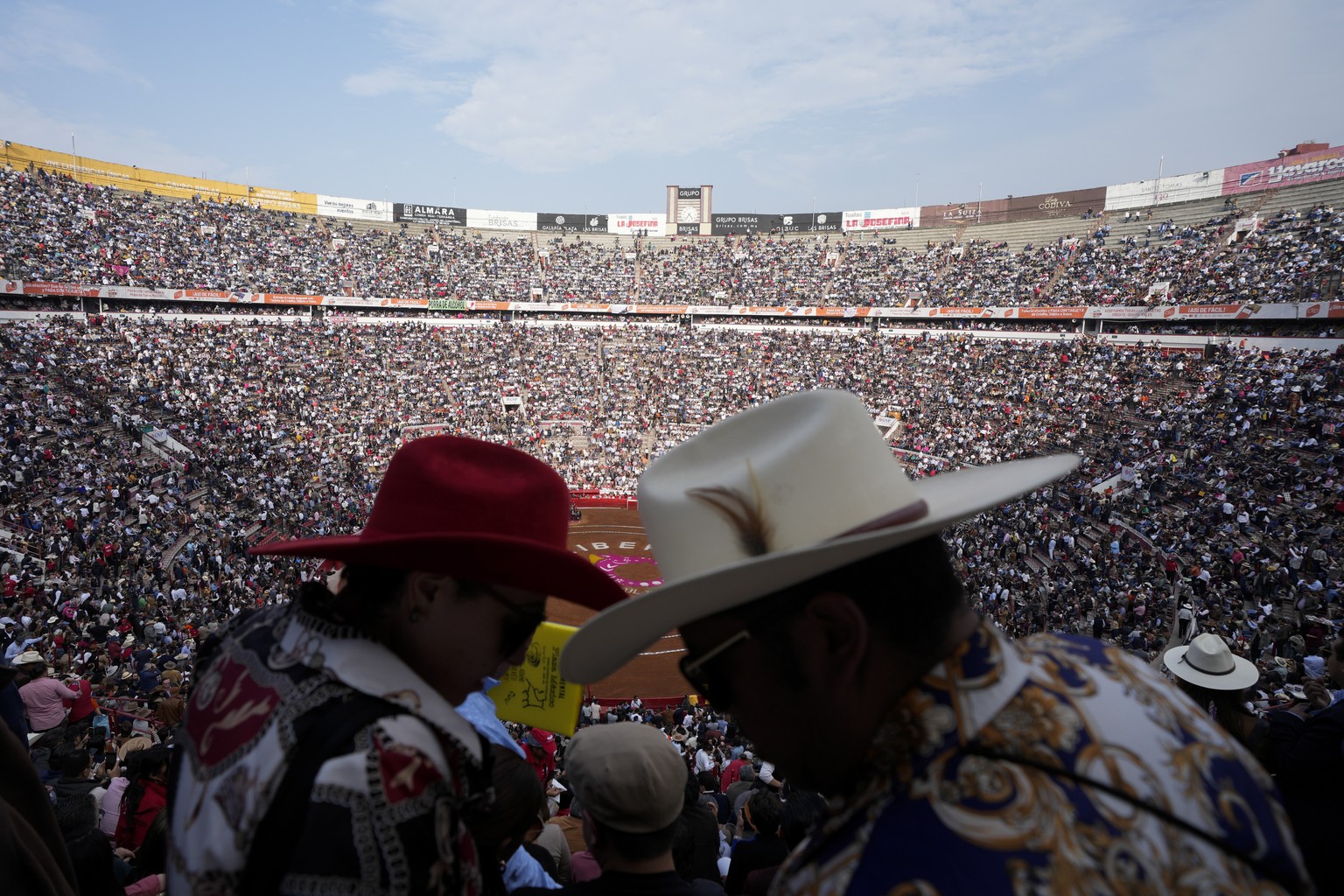 Spectators wait for a bullfight at the Plaza Mexico, in Mexico City, Sunday, Jan. 28, 2024. Bullfighting returned to Mexico City after the Supreme Court of Justice overturned a 2022 ban that prevented ...
