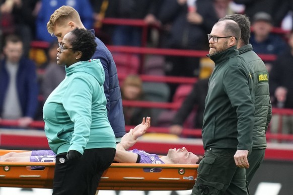 Liverpool&#039;s Diogo Jota is carried off the pitch on a stretcher after getting injured during the English Premier League soccer match between Brentford and Liverpool at the Gtech Community Stadium  ...