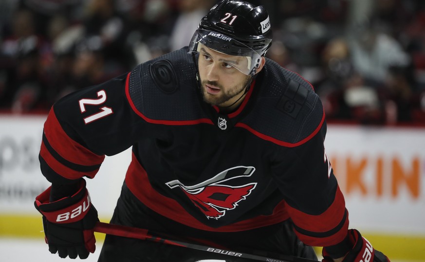 FILE - Carolina Hurricanes&#039; Nino Niederreiter (21) waits for a face-off against the New York Rangers during the second period of Game 5 of an NHL hockey Stanley Cup second-round playoff series in ...