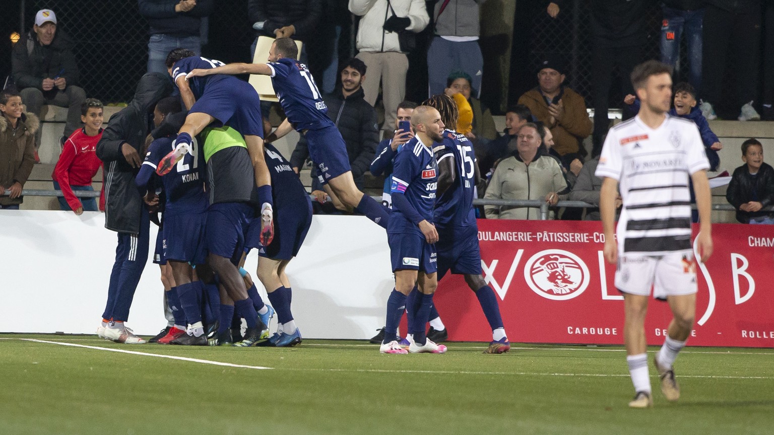 Etoile Carouge&#039;s players celebrate their goal after scoring the 1:0, during the Swiss Cup Round of 16 between Etoile Carouge FC and FC Basel, at the Stade de la Fontenette, in Carouge, Switzerlan ...