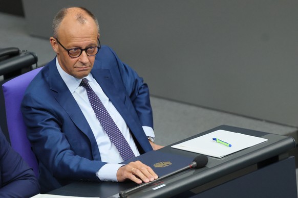 epa13099477 German Chancellor Friedrich Merz attends a session of the German parliament 'Bundestag' to deliver a government statement, in Berlin, Germany, 09 July 2026. Merz delivered a gove ...
