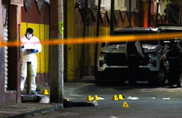 epa11255041 Forensic experts work at the scene where the candidate for mayor of the Mexican municipality of Celaya, Bertha Gisela Gaytan Gutierrez, was murdered in the Mexican municipality of Celaya, ...