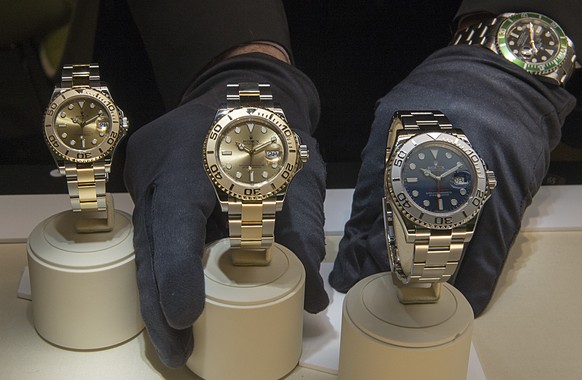 Last preparations at the Rolex booth, pictured on the press day at the watch and jewelry show Baselworld in Basel, Switzerland, on Wednesday, March 18, 2015. (AP Photo/Keystone,Georgios Kefalas)