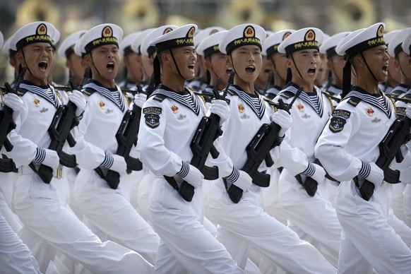 FILE - Soldiers from China&#039;s People&#039;s Liberation Army (PLA) Navy march in formation during a parade to commemorate the 70th anniversary of the founding of Communist China in Beijing, Oct. 1, ...