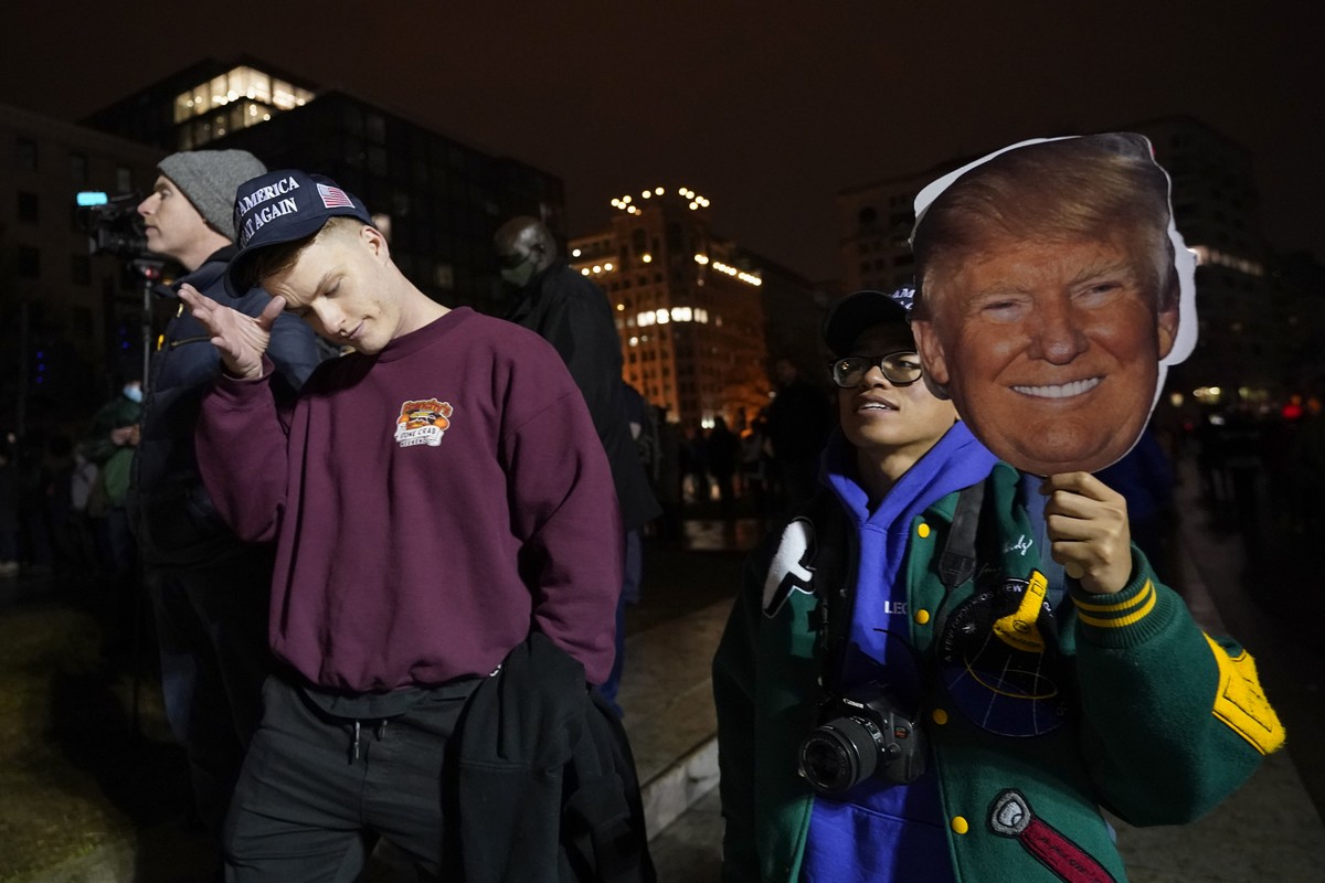 People attend a rally at Freedom Plaza Tuesday, Jan. 5, 2021, in Washington, in support of President Donald Trump. (AP Photo/Julio Cortez)