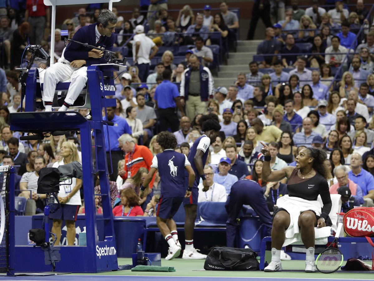 Serena Williams talks with chair umpire Carlos Ramos during a changeover against Naomi Osaka, of Japan, in the women's final of the U.S. Open tennis tournament, Saturday, Sept. 8, 2018, in New Yo ...