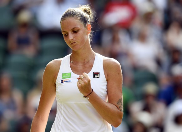 epa06070438 Karolina Pliskova of the Czech Republic celebrates a winner against Magdalena Rybarikova of Slovakia in their second round match during the Wimbledon Championships at the All England Lawn  ...