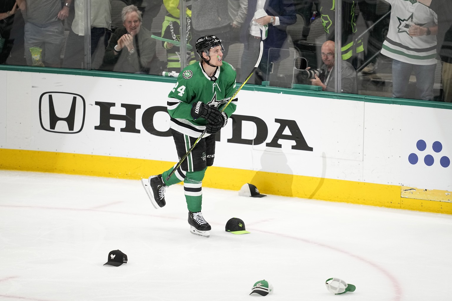 Dallas Stars center Roope Hintz (24) skates past hats on the ice after he scored his third goal of the game that came in the third period of Game 2 of an NHL hockey Stanley Cup first-round playoff ser ...