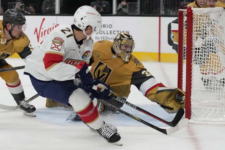 Vegas Golden Knights goaltender Adin Hill (33) blocks a shot by Florida Panthers center Nick Cousins (21) during the third period of an NHL hockey game Thursday, Jan. 12, 2023, in Las Vegas. (AP Photo ...