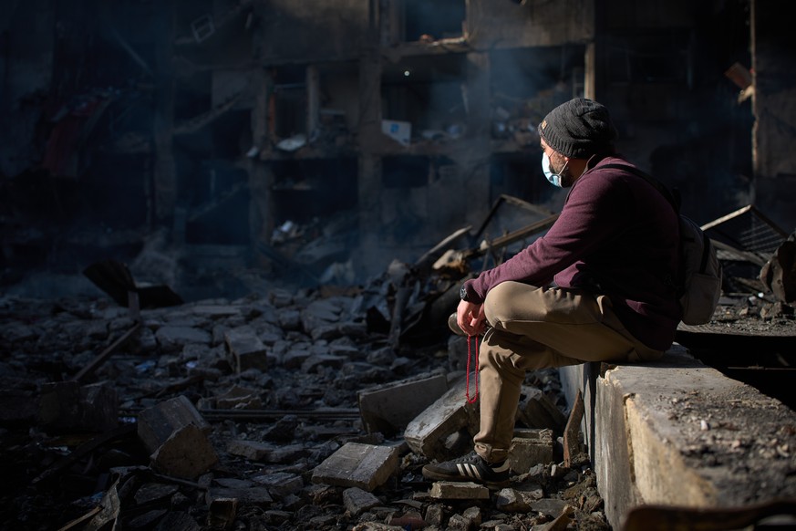 A man sits next to an apartment building destroyed in an Israeli airstrike a day earlier in Beirut, Lebanon, Thursday, April 9, 2026. (AP Photo/Emilio Morenatti)
Lebanon Israel Iran War