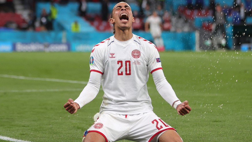 epa09291972 Yussuf Poulsen of Denmark celebrates after scoring the 2-0 lead during the UEFA EURO 2020 group B preliminary round soccer match between Russia and Denmark in Copenhagen, Denmark, 21 June  ...