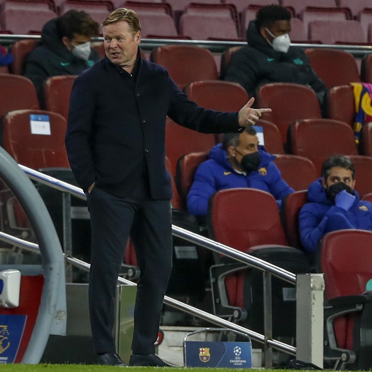 Barcelona's head coach Ronald Koeman gestures during the Champions League round of 16, first leg soccer match between FC Barcelona and Paris Saint-Germain at the Camp Nou stadium in Barcelona, Sp ...