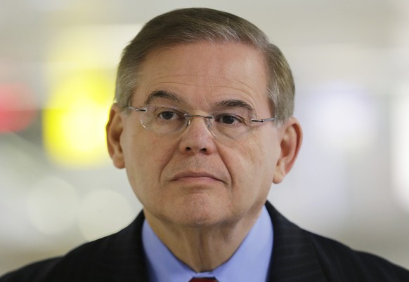 FILE - In this March 1, 2013, file photo, Sen. Robert Menendez listens during a news conference, at Newark Liberty International Airport in Newark, N.J. Attorney General Eric Holder is declining to sa ...