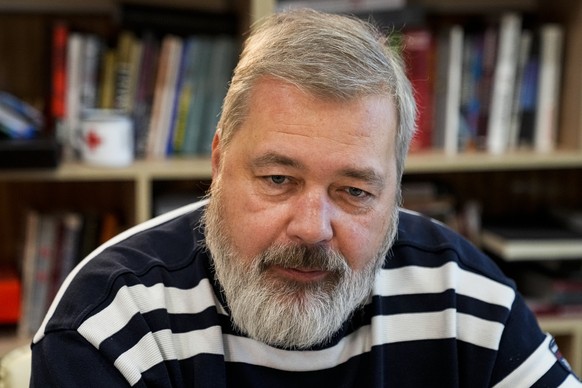 FILE - In this Oct. 7, 2021 file photo, Novaya Gazeta editor Dmitry Muratov speaks during an interview with The Associated Press at the Novaya Gazeta newspaper, in Moscow, Russia. As a new Nobel Peace ...