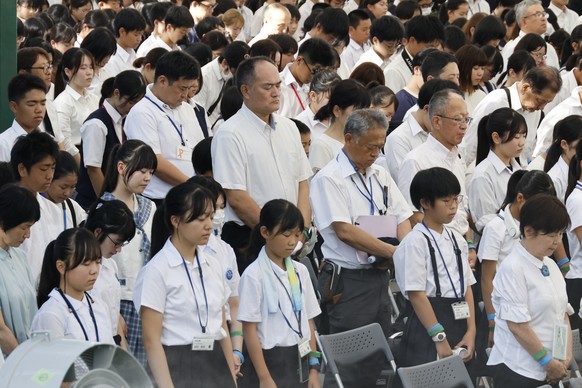 epa12285408 Attendees observe a moment of silence during the Peace Memorial Ceremony on the 80th anniversary of the atomic bombing of Hiroshima at Peace Memorial Park in Hiroshima, Japan, 06 August 20 ...