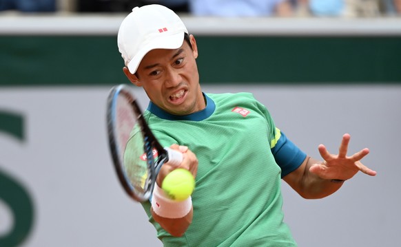 epa09247218 Kei Nishikori of Japan in action during the 3rd round match against Henri Laaksonen of Switzerland at the French Open tennis tournament at Roland Garros in Paris, France, 04 June 2021. EPA ...