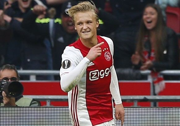 Ajax's Kasper Dolberg celebrates after scoring the second of his team during the first leg semi final soccer match between Ajax and Olympique Lyon in the Amsterdam ArenA stadium, Netherlands, Wednesda ...