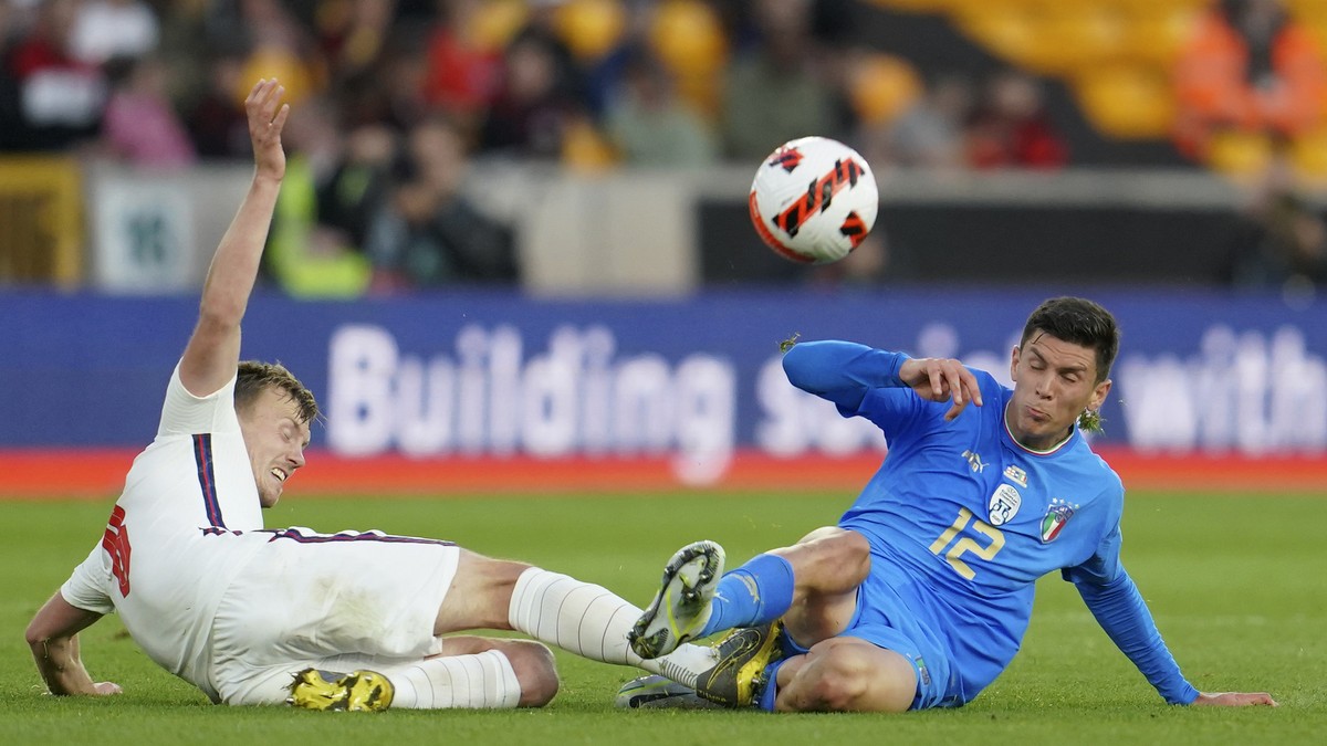 James Ward-Prowse of England, left, fouls Matteo Pessina of Italy during the Nations League soccer match between England and Italy at Molineux Stadium in Wolverhampton, England, Saturday, June 11, 202 ...