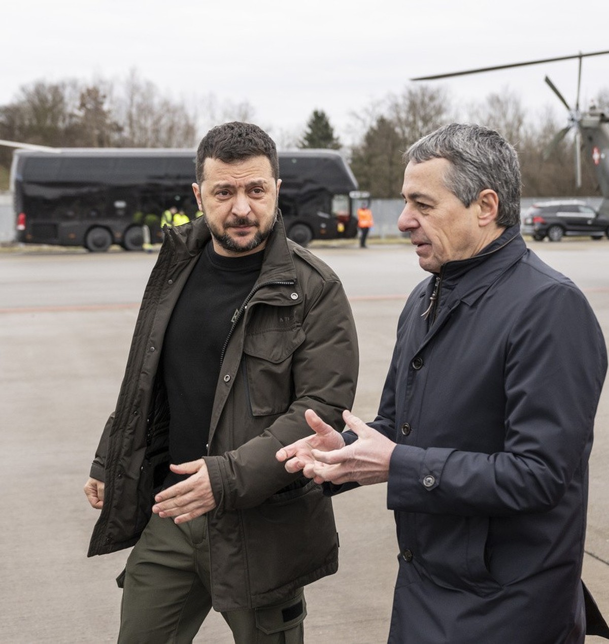 Switzerland's Foreign Minister Federal Councillor Ignazio Cassis, center, welcomes Volodymyr Zelenskyy, President of Ukraine, left, on Monday, January 15, 2024 at the Airport of Zurich Kloten, Sw ...
