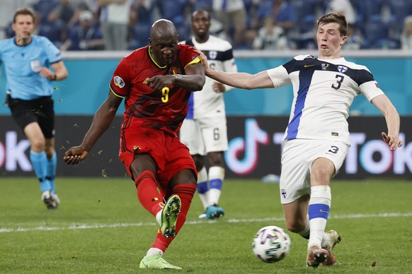 Belgium&#039;s Romelu Lukaku, left, scores his side&#039;s second goal during the Euro 2020 soccer championship group B match between Finland and Belgium at Saint Petersburg Stadium in St. Petersburg, ...