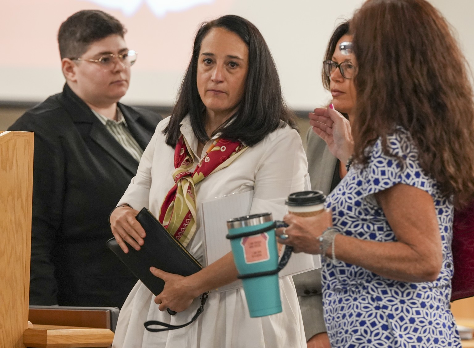 Renata Rojas, OceanGate mission specialist, center, pauses during at the Titan marine board formal hearing inside the Charleston County Council Chambers, Thursday, Sept. 19, 2024, in North Charleston, ...