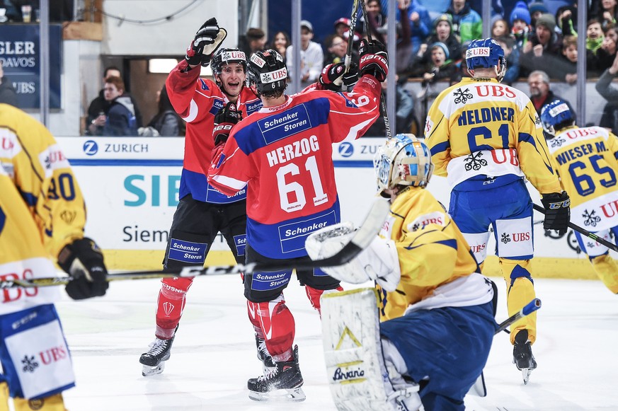 Suisse player Michael Fora celebrates with the team after scoring 3:3 during the game between Team Suisse and HC Davos at the 91th Spengler Cup ice hockey tournament in Davos, Switzerland, Saturday, D ...