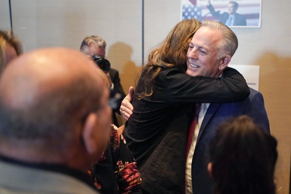 Clark County Sheriff Joe Lombardo, Republican candidate for governor of Nevada, receives a hug as he greets supporters after speaking during an election night campaign event Tuesday, Nov. 8, 2022, in  ...